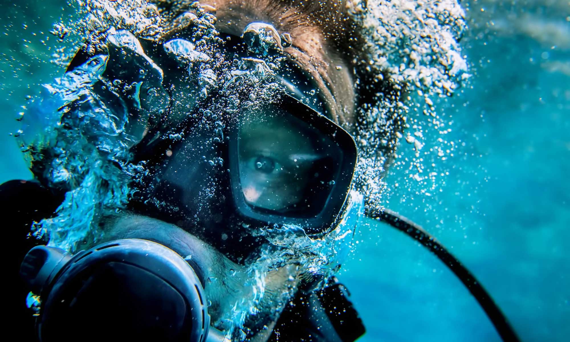 Padi diver with a mask full of water.
