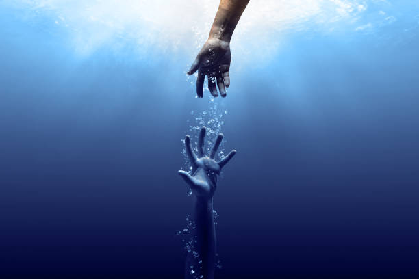Help me.  A scuba diver unterwater in distress.  Lend a helping hand.