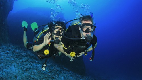 Padi divers underwater loving the certification.